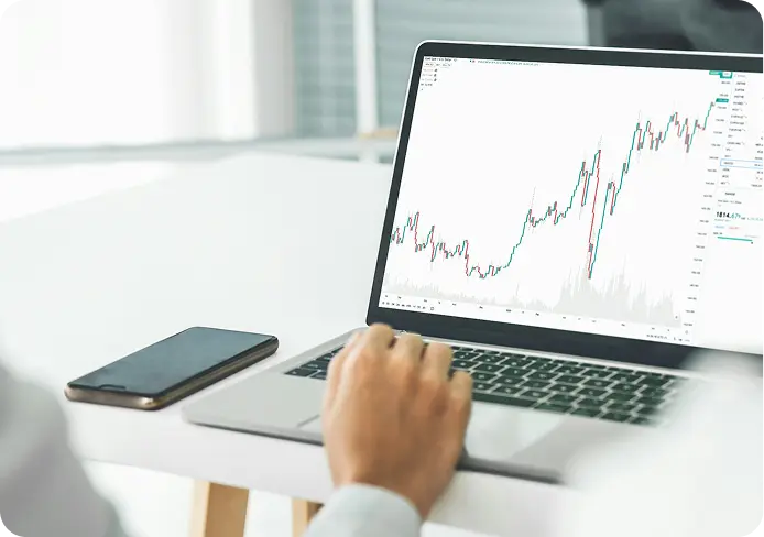 alt="Engineer reviewing system data on a laptop during deployment in a production environment"